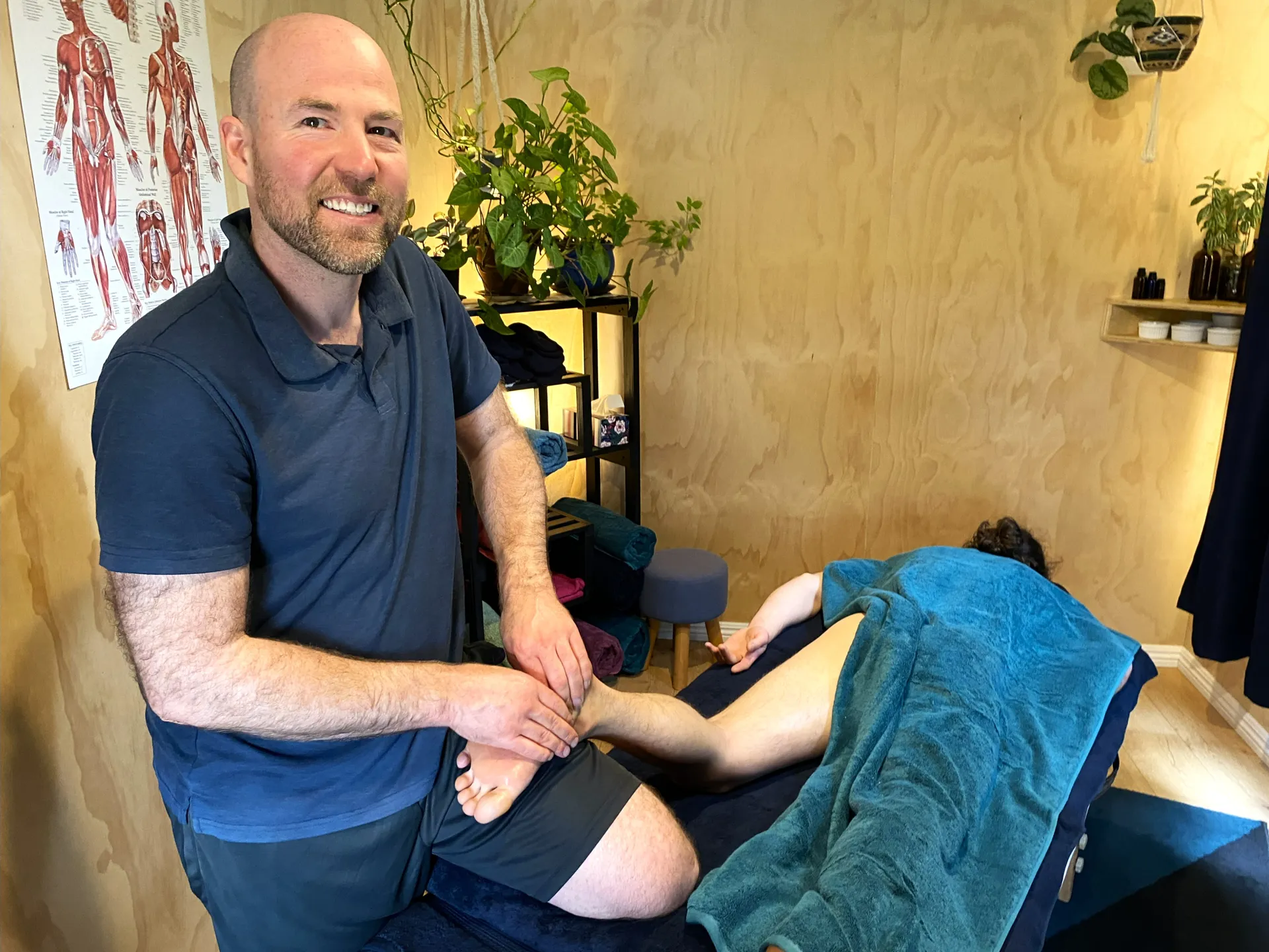 Andrew Bolton giving a foot massage