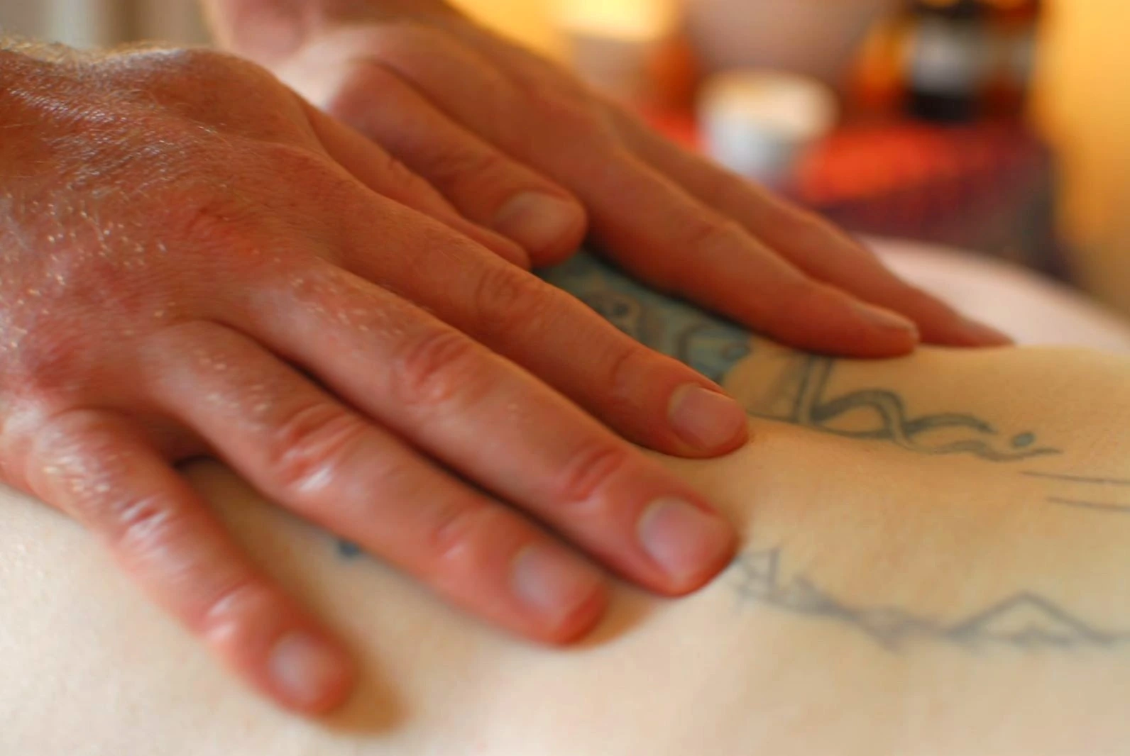 Hands massaging tight shoulder muscles